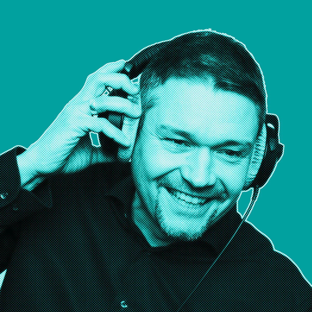 Turquoise-filtered picture of man smiling and wearing headphones, holding them with his right hand